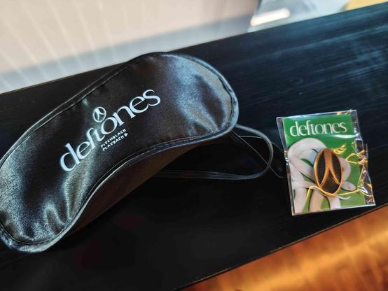 Eye mask and a pin from the "private music" pre release listening show.