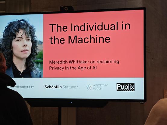 Photo of the announcement slide of the event "The Individual in the Machine - Meredith Whittaker on reclaiming Privacy in the Age of AI"
