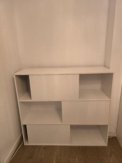 White Side board with the doors in irregular patterns