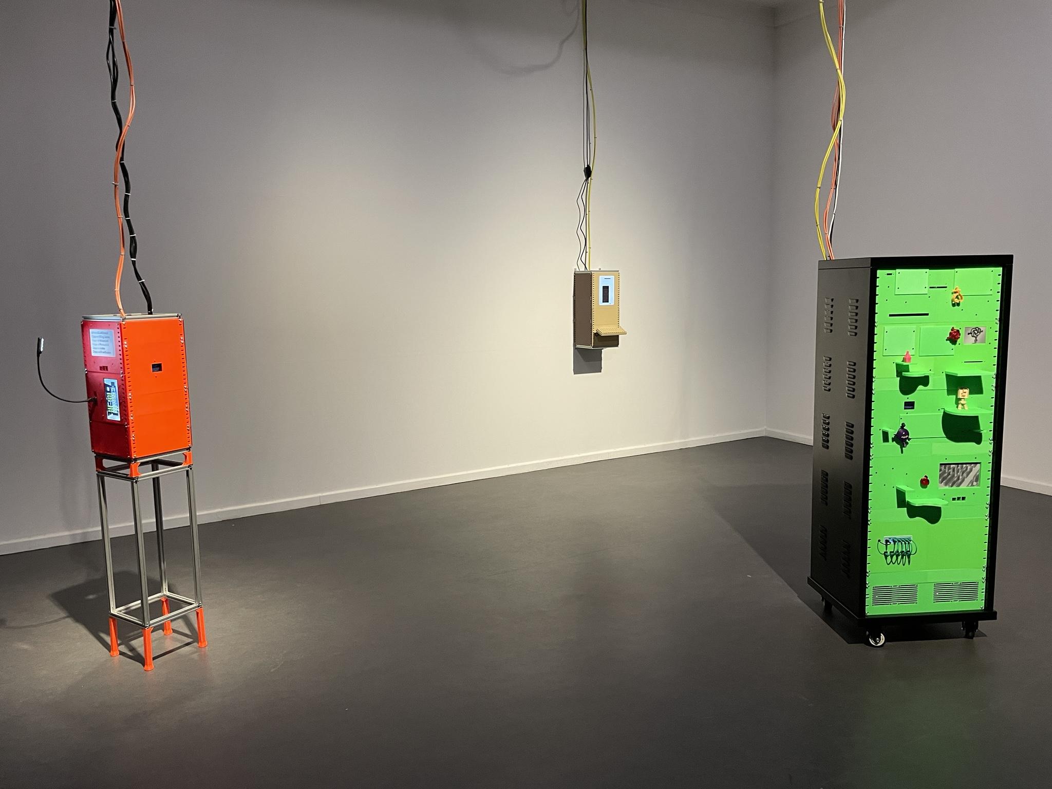 Installation View in white cube gallery. 3 of her machines connected via cables