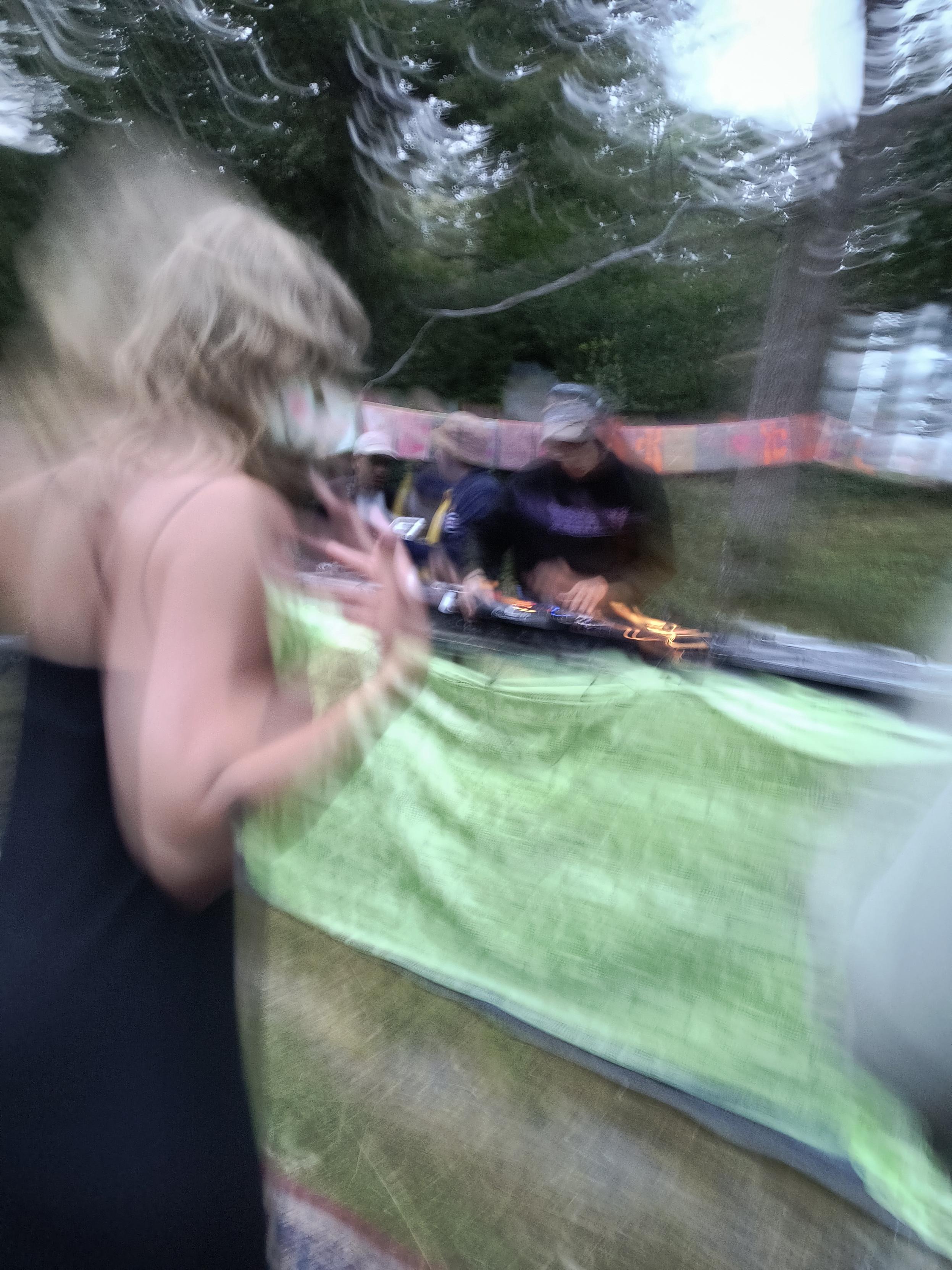 Dancefloor, front row in the morning. Fuzzy pic of one person dancing + dj